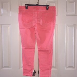 Neon coral skinny stretch jeans